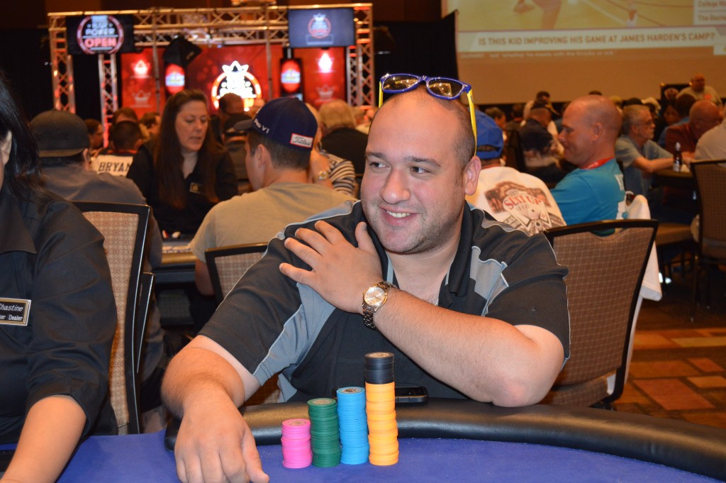 Andy Giatas is sitting behind a mountain of chips and he tells us how he got them. Giatas flopped quad fours and to his surprise saw two players move all in. He earned the double elimination and is now playing 100,000 which is good for the chip lead here in the early levels.