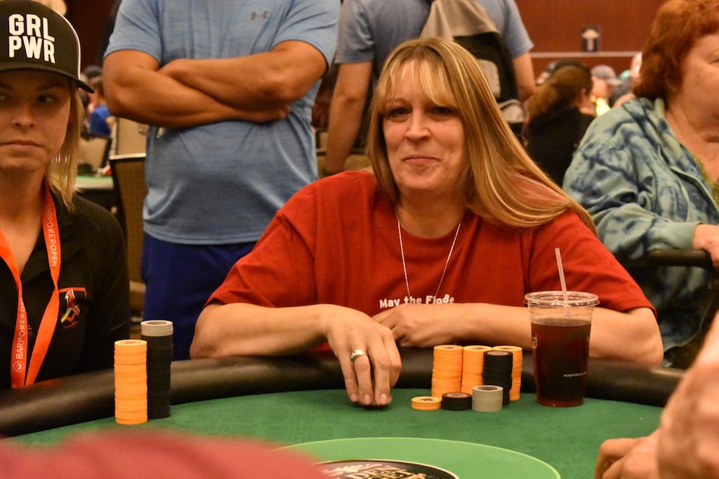 Caryn Bustos, the reigning champion is still alive with a healthy stack of 400,000